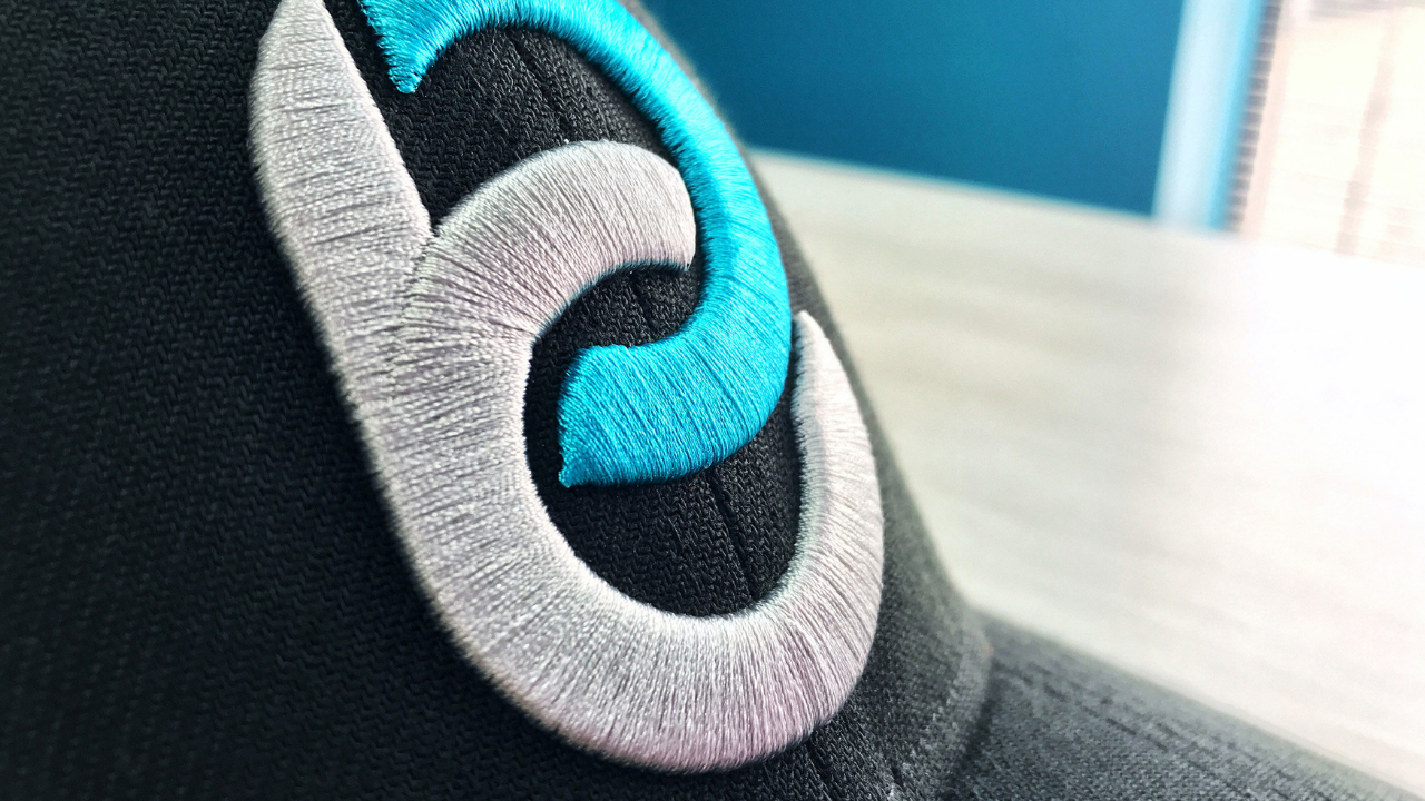High-density 3D puff embroidery stitched on structured cap panel